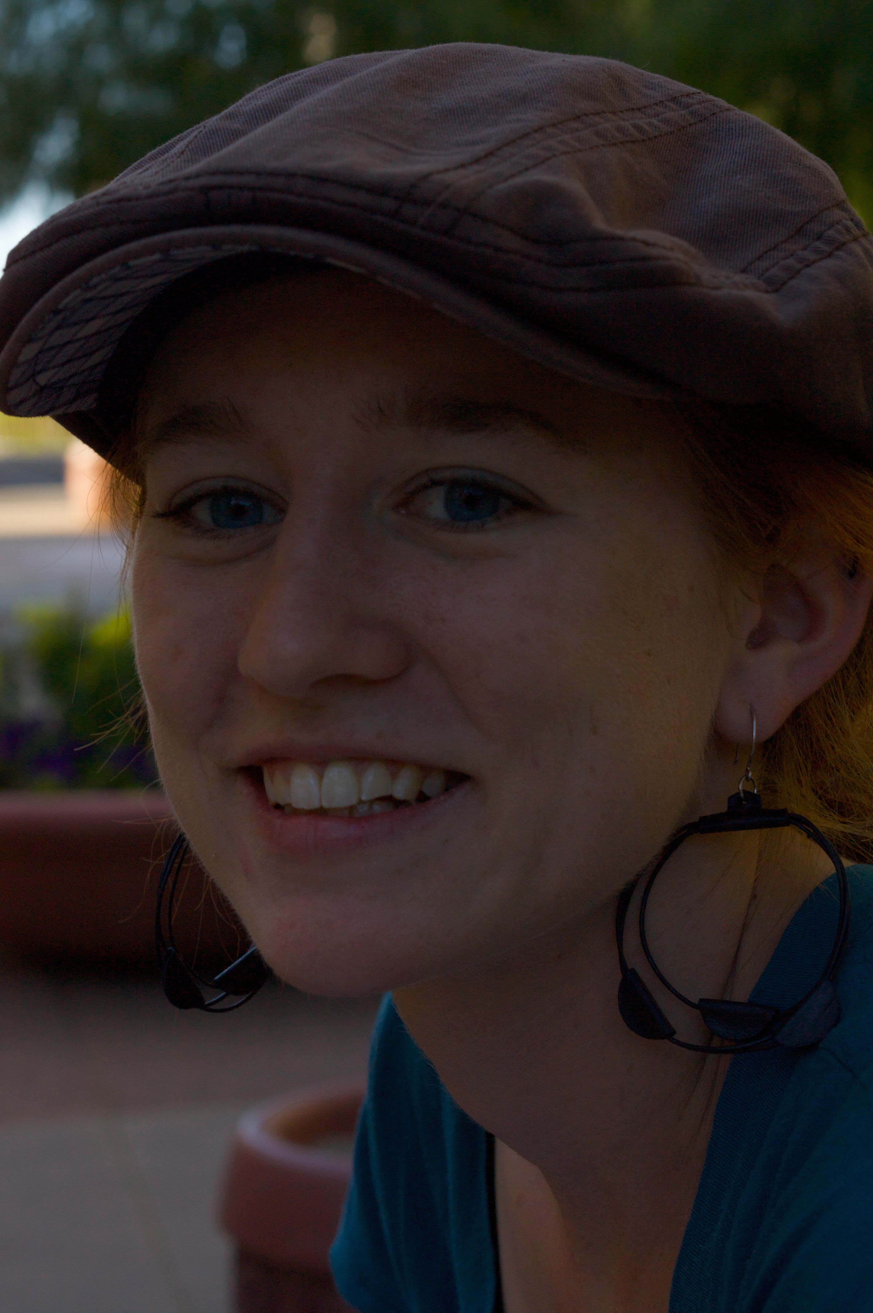 Erin Walker smiles at the camera while wearing a hat.