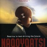 Poster for the film Naqoyqatsi, featuring an image of a crash-test dummy in profile, wearing a suit and tie.