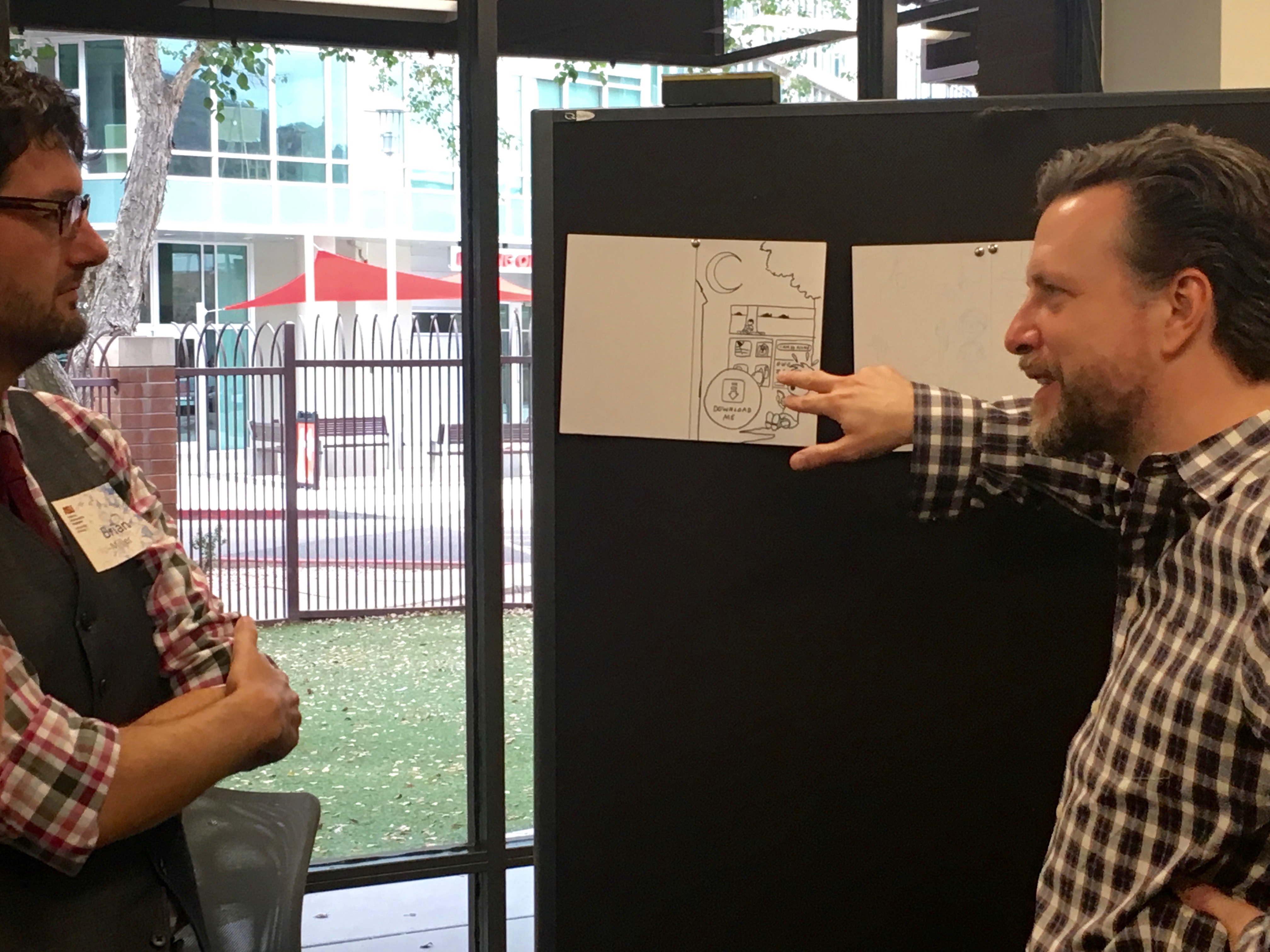 Mark Siegel and Brian Miller discuss a storyboard