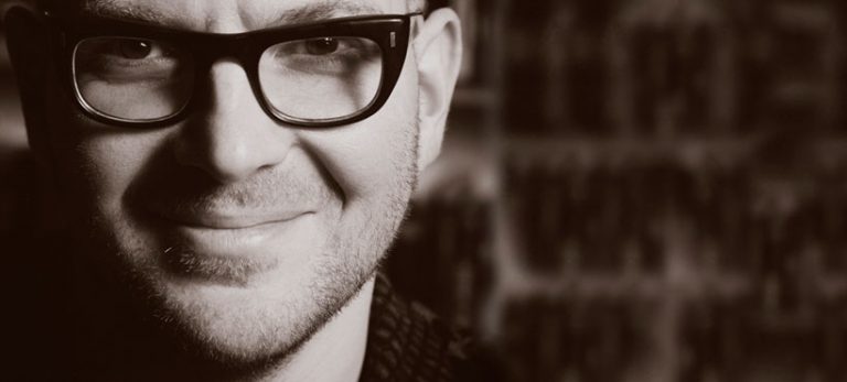 Black and White photo of Cory Doctorow with black glasses