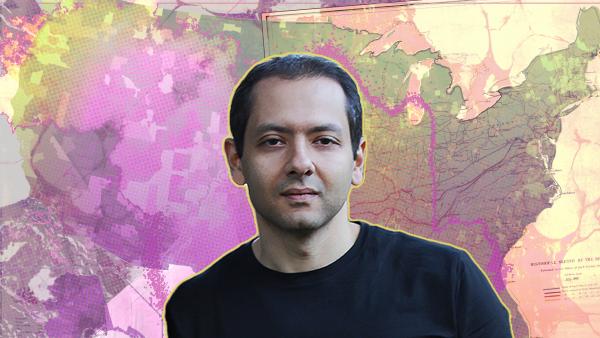 Image of author Omar El Akkad, shoulders-up, in a black shirt, against the backdrop of a multicolored map of the United States.